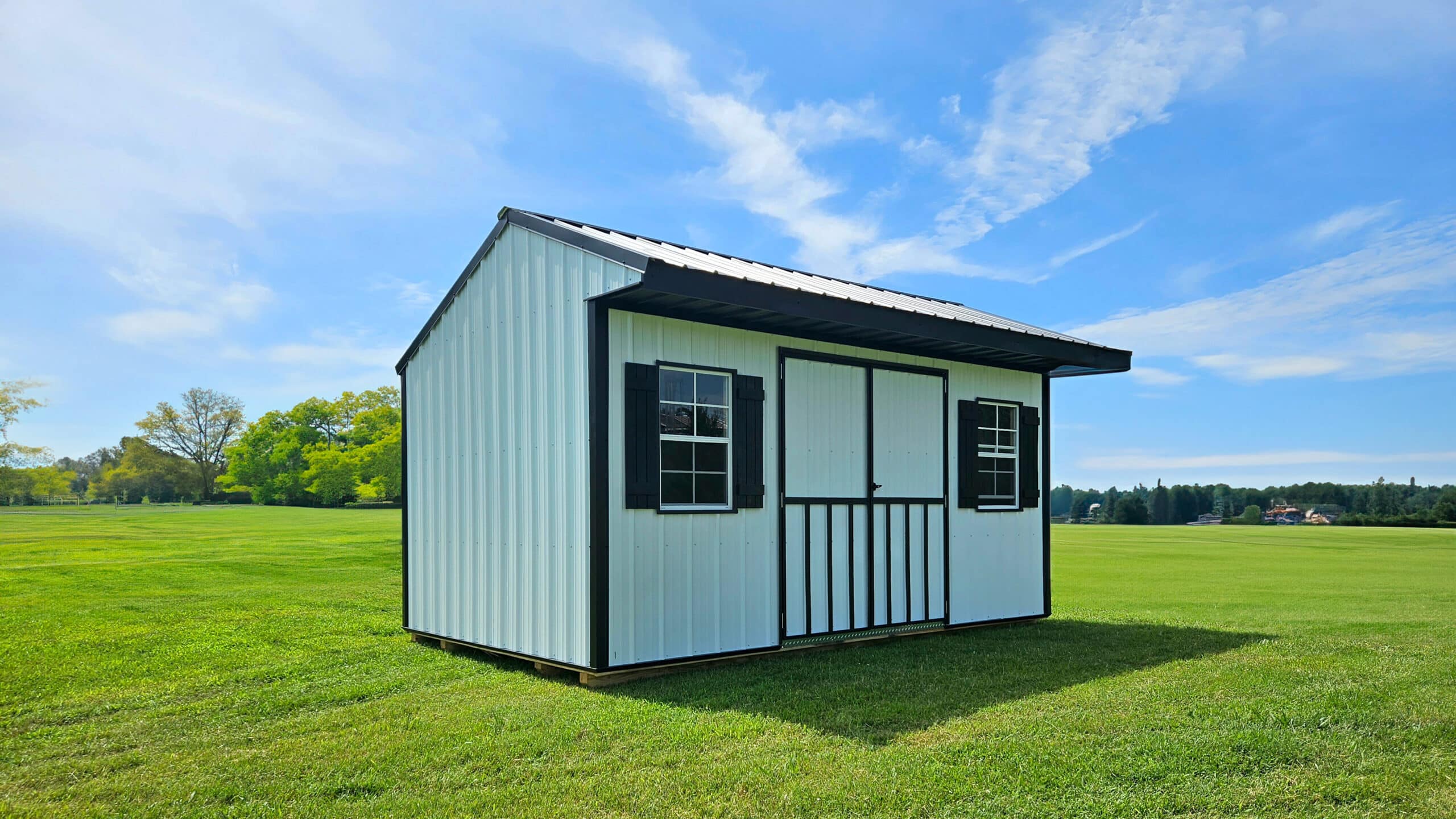 A shed with white metal siding and roofing for sale in Fayetteville, AR