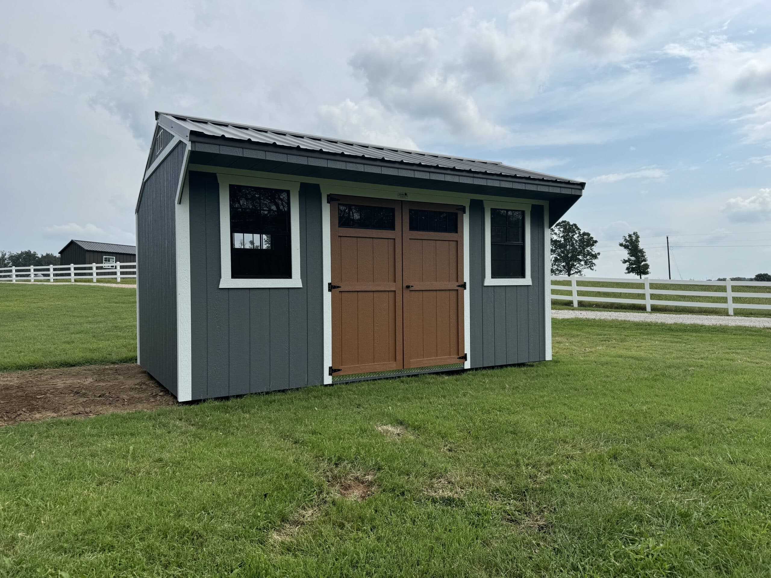 a wood shed with brown double doors in St. Louis MO